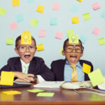 Creative advertising kids with post it notes on their heads