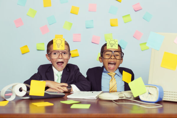 Creative advertising kids with post it notes on their heads